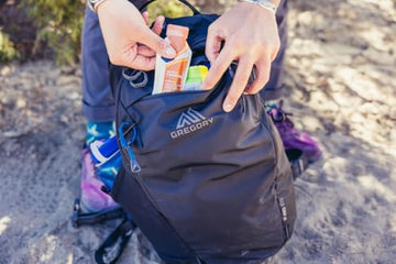 Zippered main access with molded ring pulls speeds packing and unpacking.