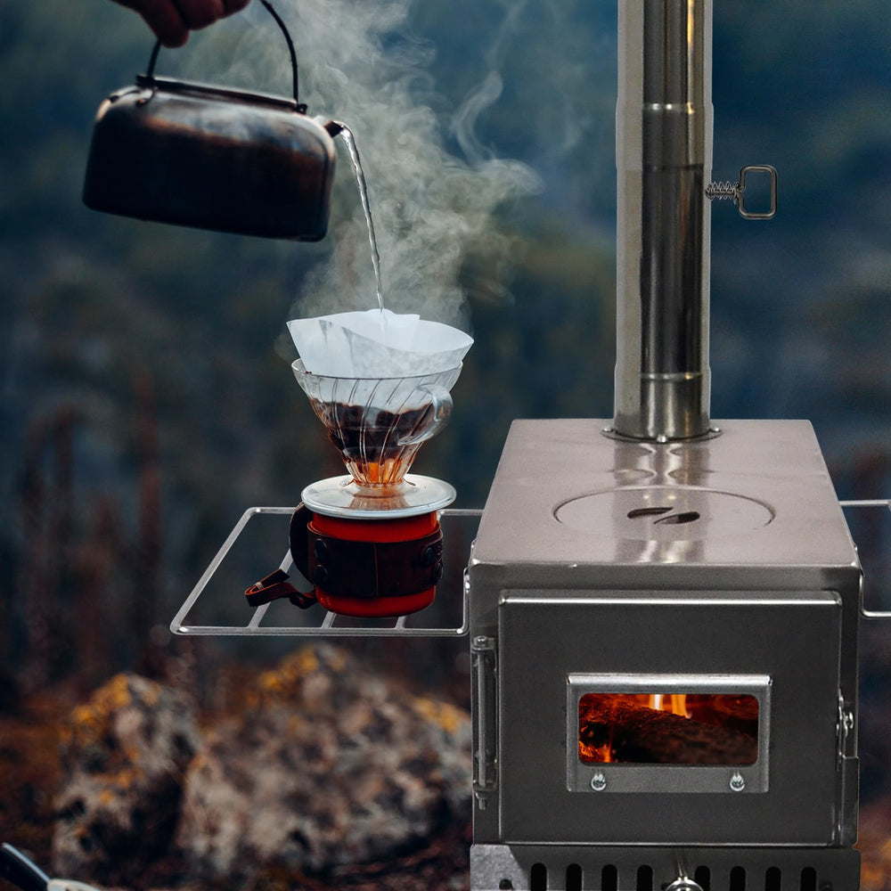 Greyhoo outdoor wood stove with chimney pipe and hook packed for compact transport.