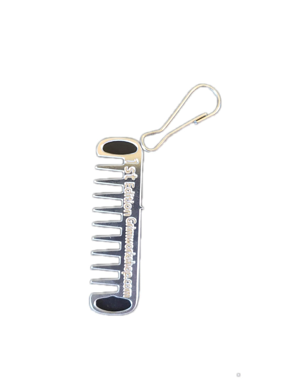 Grim Workshop Comb Micro Tool mounted on a backpack zipper for on-demand grooming.