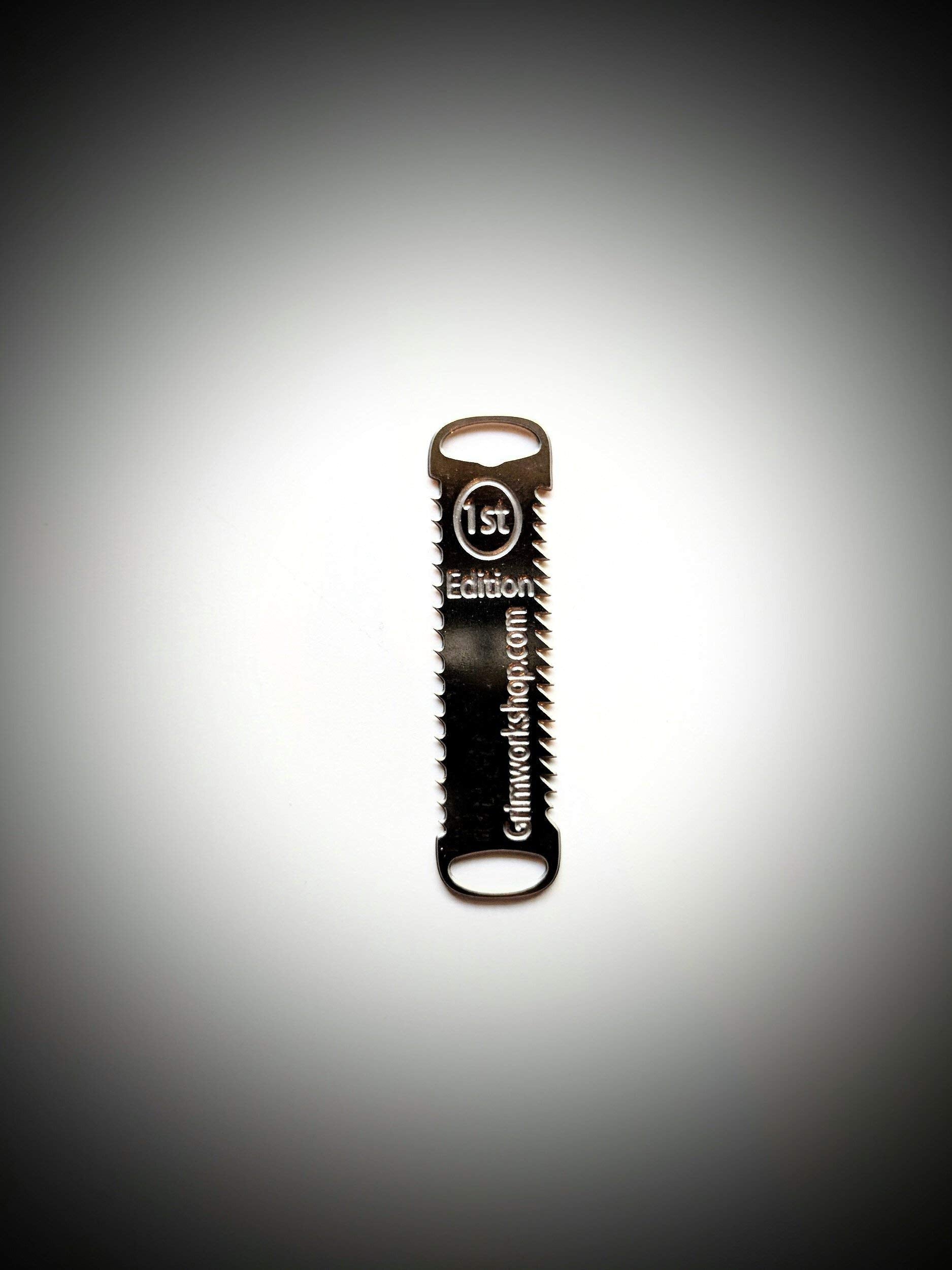Grim Workshop compact tool with grip-friendly end holes for cords.