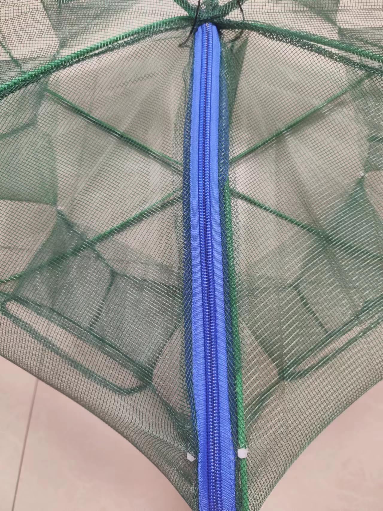 Trap folded for compact storage