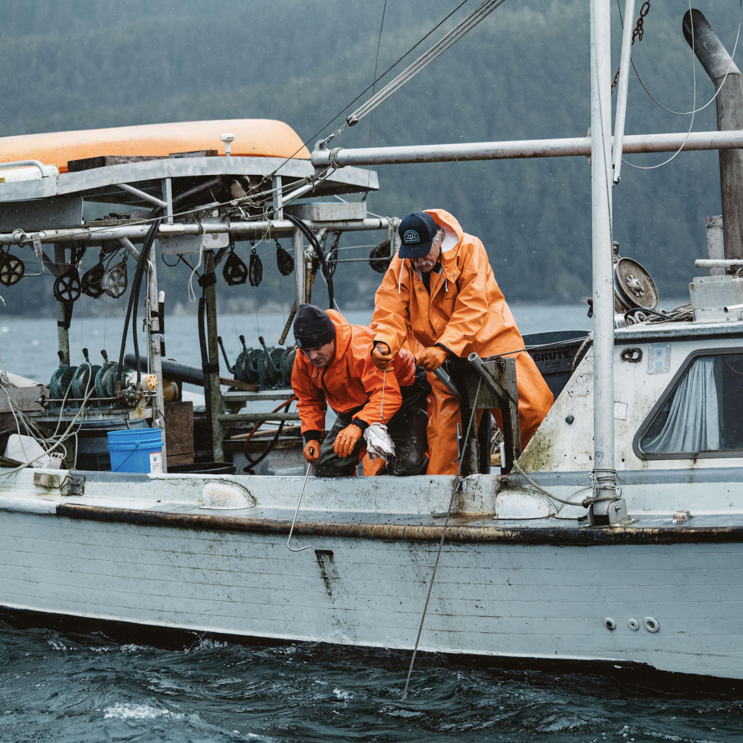 Grundéns Brigg 44 Parka orange back hem stormshield offers extra weather protection.