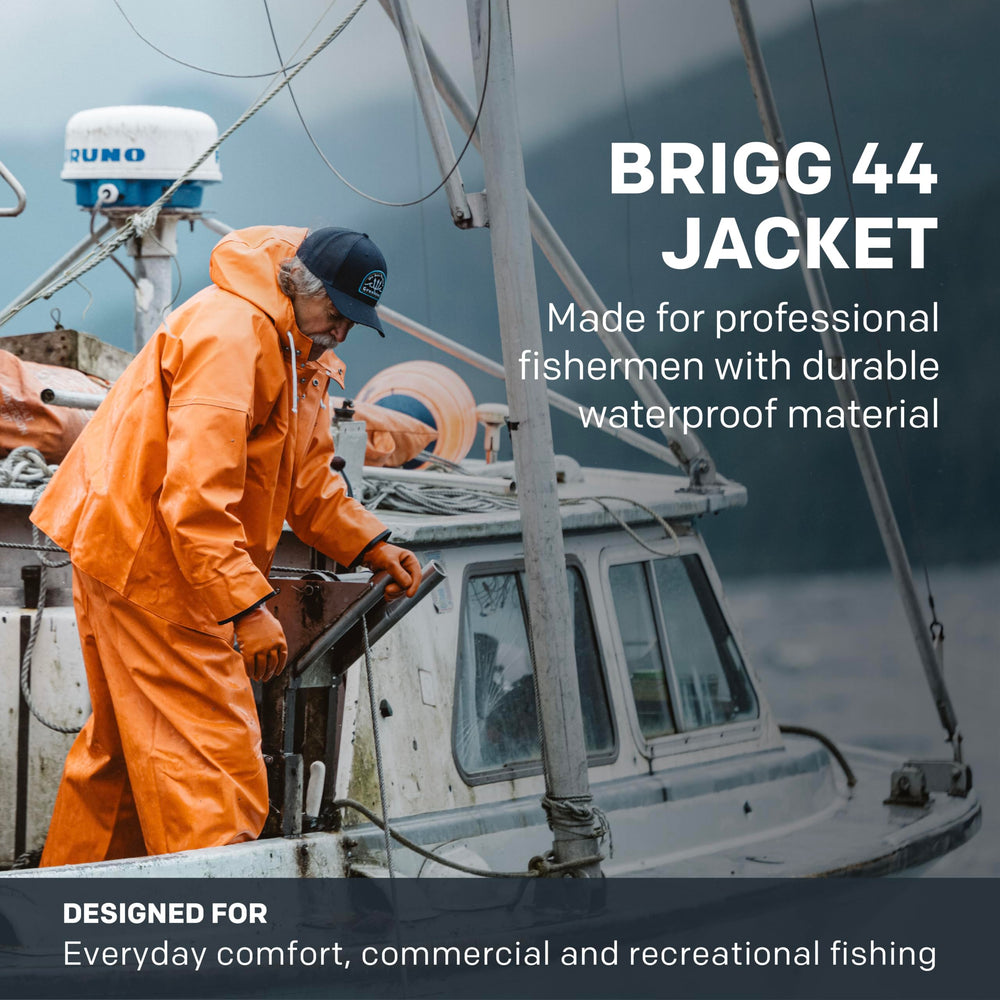 Grundéns Brigg 44 Parka orange waterproof shell close-up reveals durable PVC coating.
