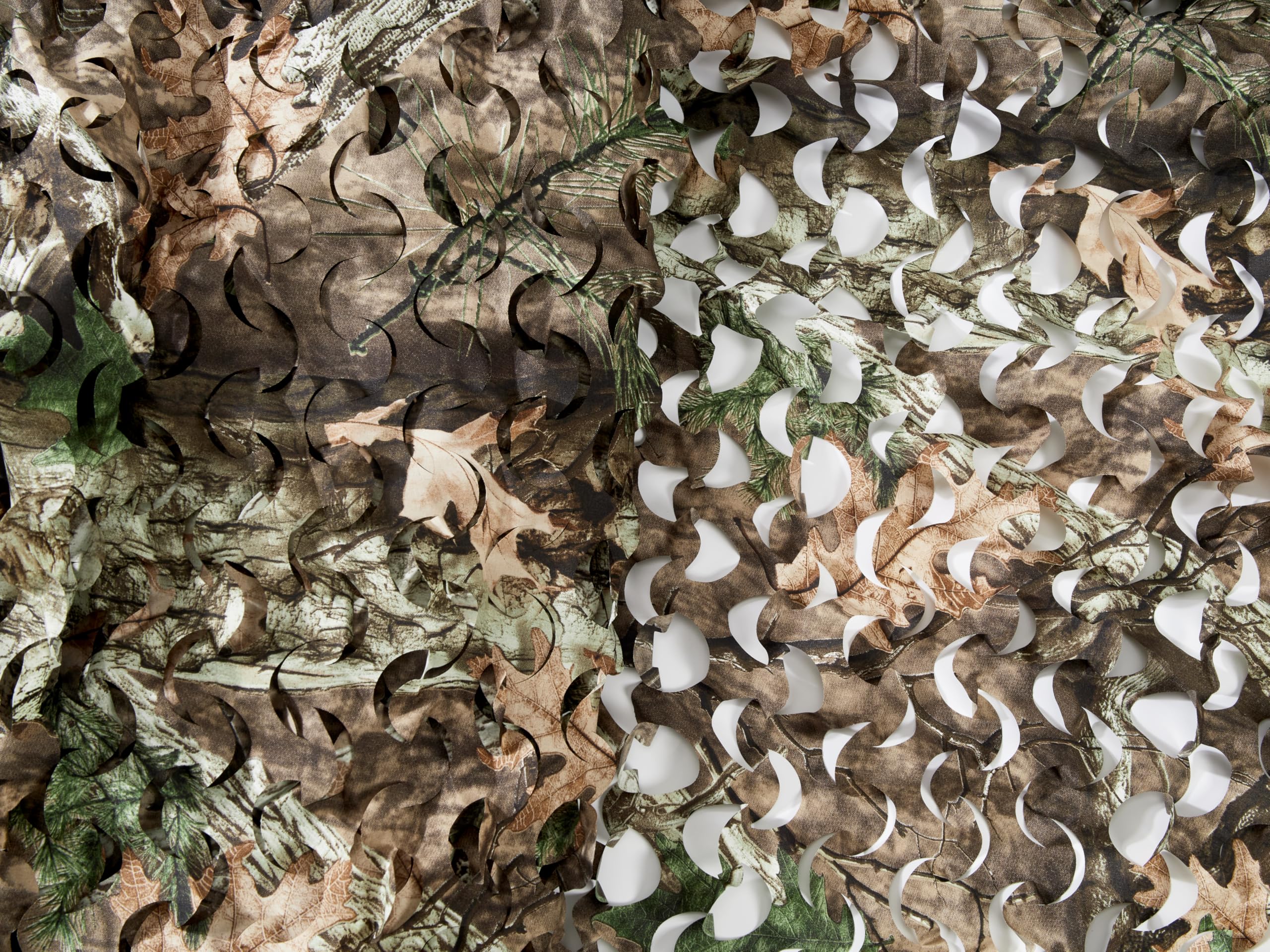 GRVCN camo netting forest concealment scene demonstrates blending with natural backgrounds.