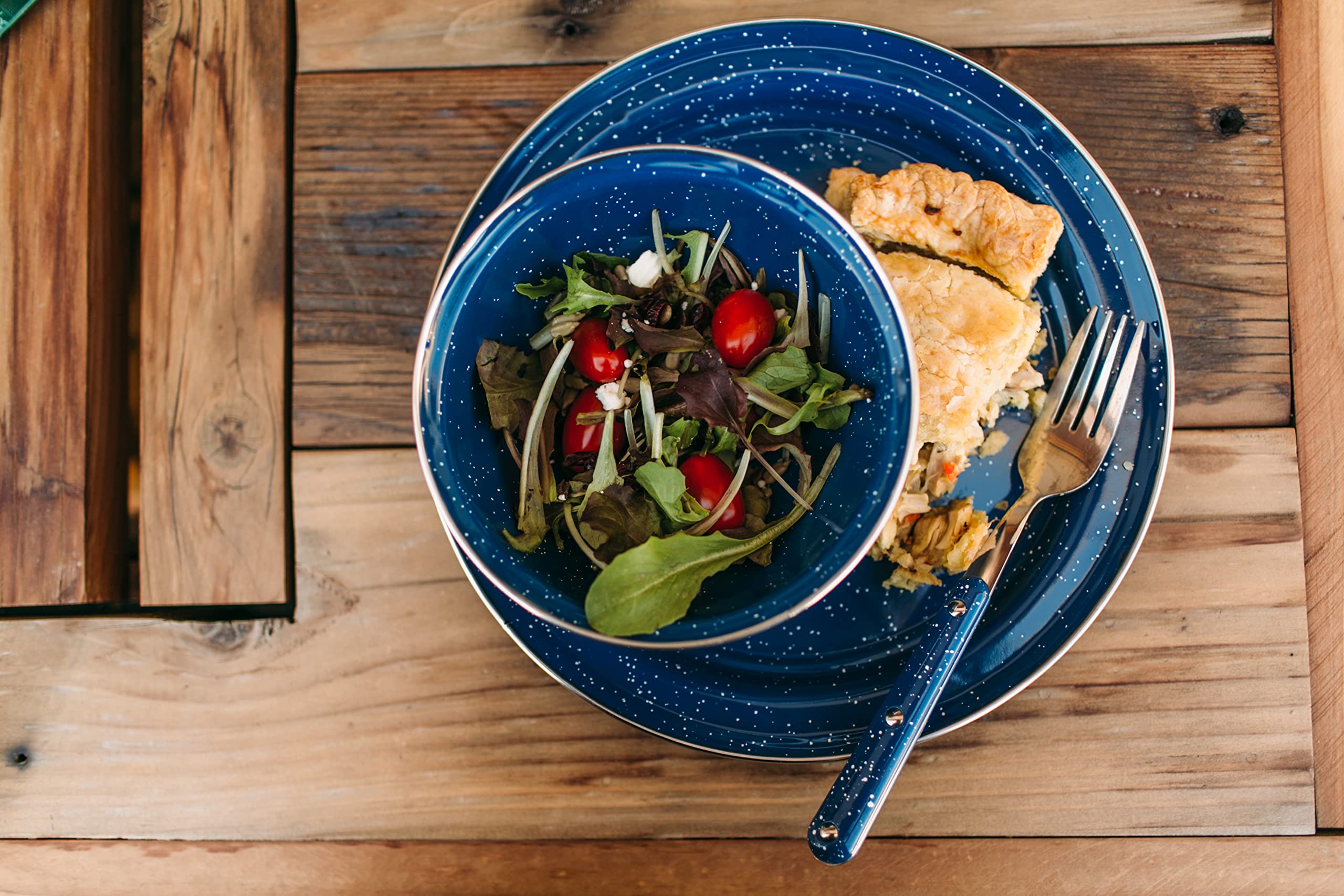 GSI Outdoors camp dinnerware set for four plates, bowls, and mugs ready for group meals.