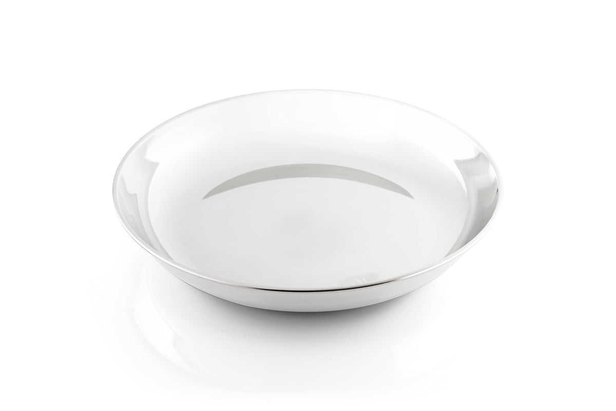 GSI Outdoors Glacier Stainless Deep Plate on camping table for rugged outdoor meals.