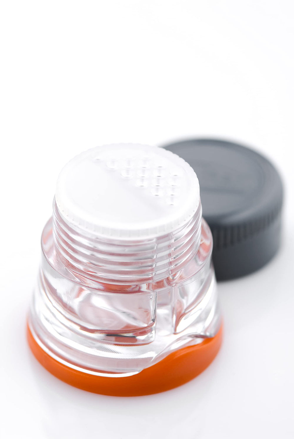 GSI Outdoors Spice Missile refilling cap stored below base for mess-free topping