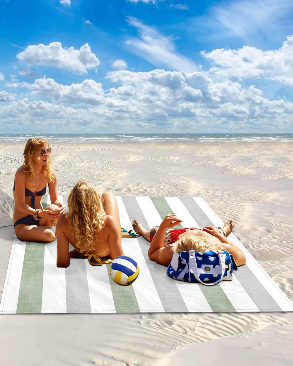 Gsypo beach blanket with sand pockets and stakes prevents shifting in windy conditions.