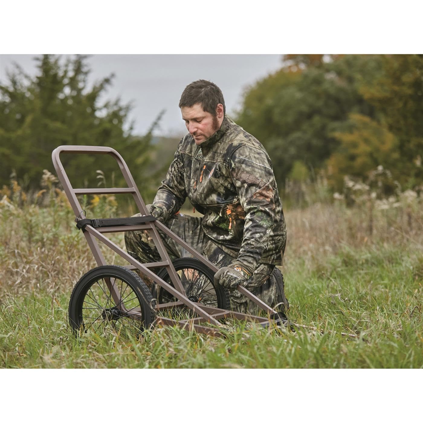 Guide Gear Deluxe Deer Cart with 16-inch wheels glides over rough terrain.