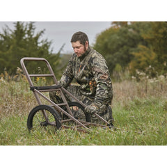 Guide Gear Deluxe Deer Cart with 16-inch wheels glides over rough terrain.