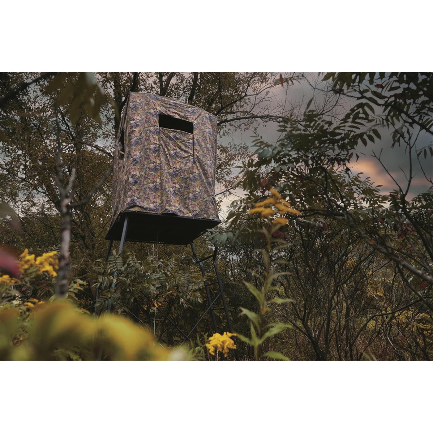 Guide Gear elevated deer blind in DZX camo blending with surroundings.