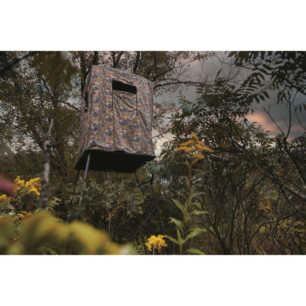 Guide Gear elevated deer blind in DZX camo blending with surroundings.