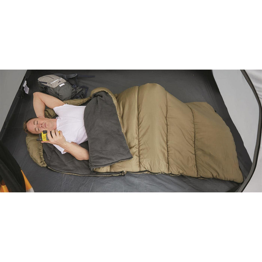 Guide Gear sleeping bag with four compression straps for packing