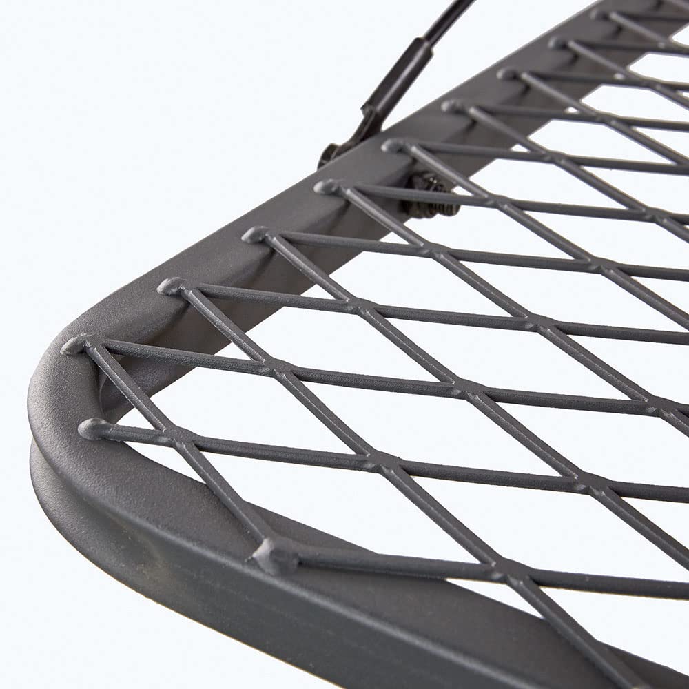 Guide Gear Hang-On Tree Stand ratchet straps indicating secure attachment on rugged terrain.