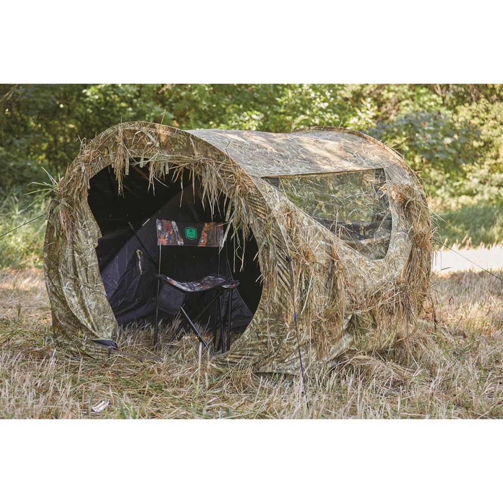 Guide Gear hay bale blind stake and guy lines ensure secure setup on uneven ground.