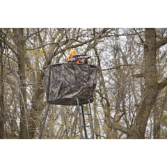 Guide Gear camo hunting stand cover in use, providing shelter and weather protection.