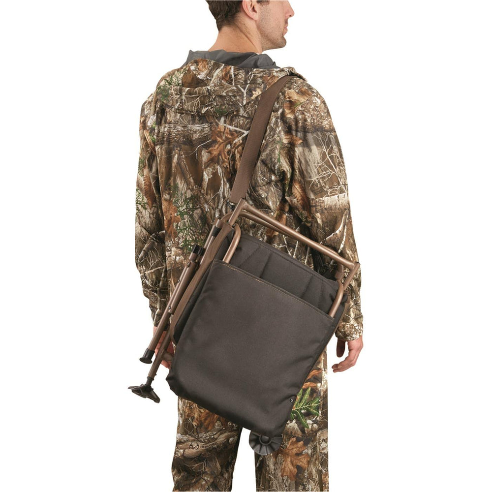 Folding Huntrite chair shown folded for easy carry with strap.