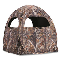 Guide Gear HuntRite Deluxe side view showing weather-resistant shell in natural terrain.
