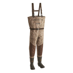 Guide Gear chest waders camo boot close-up showing rugged grip on wet terrain.