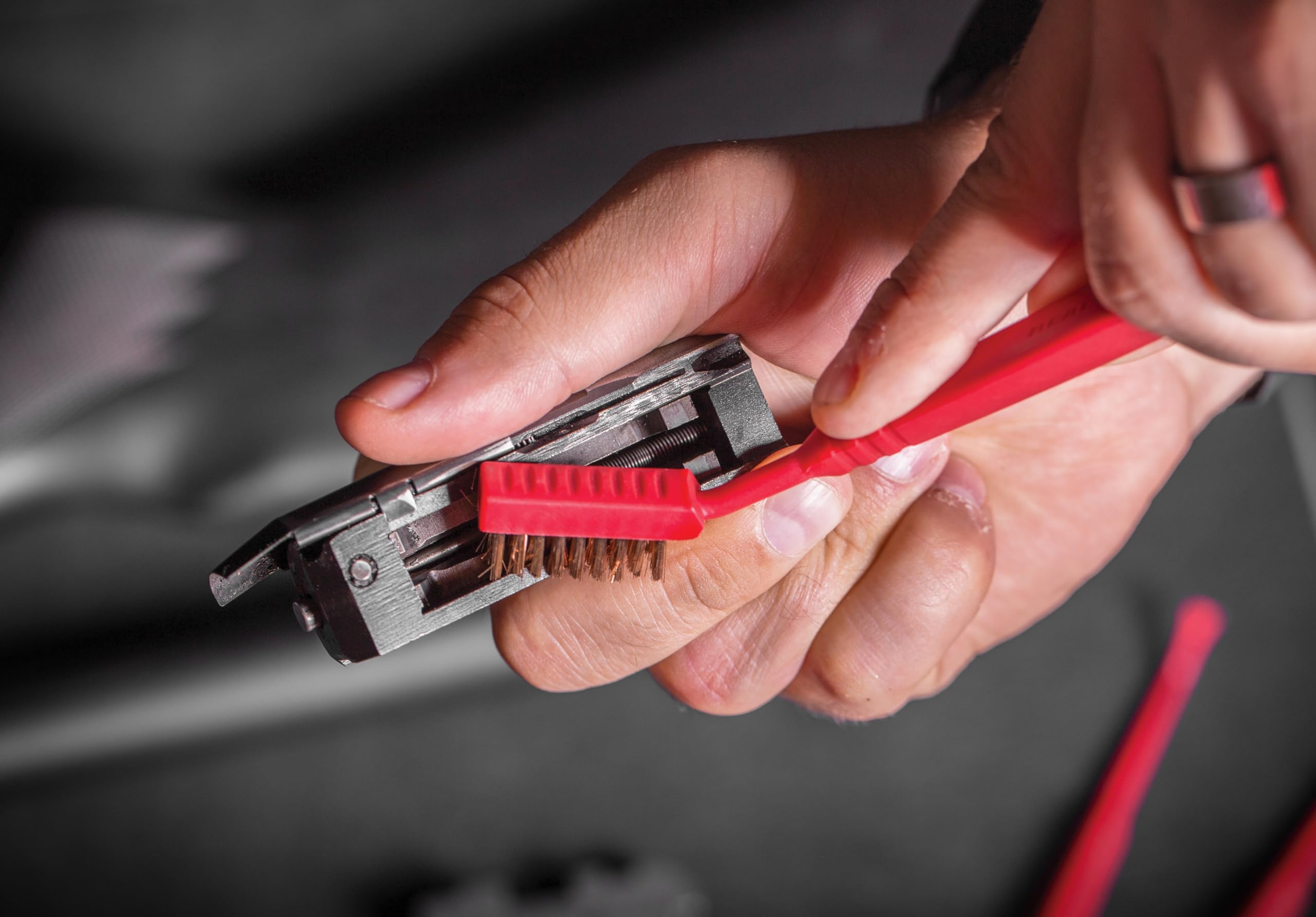 Gun cleaning tools and brushes laid out for detail cleaning