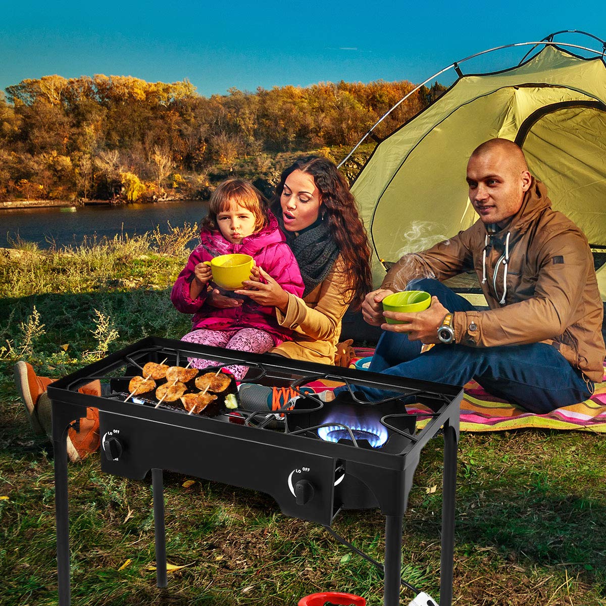 GYMAX camping stove in outdoor setting ideal for camping and tailgating.