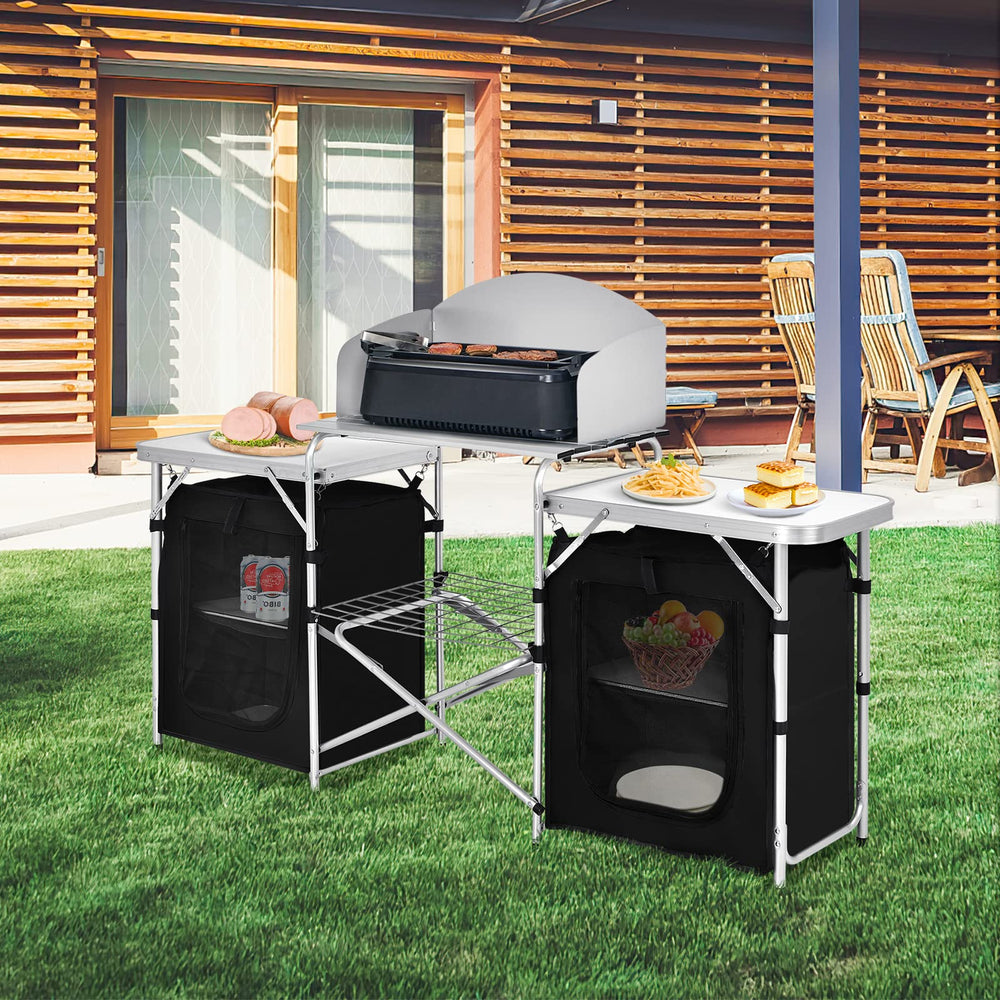 GYMAX foldable camping table in use, quick setup for meals on the go.