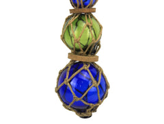 Blue green blue glass buoy with vintage fishing netting decor
