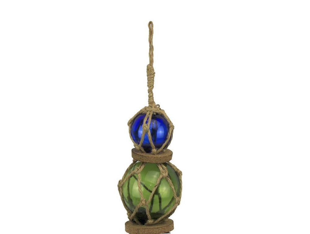 Nautical home or office decor featuring a glass buoy with brown netting