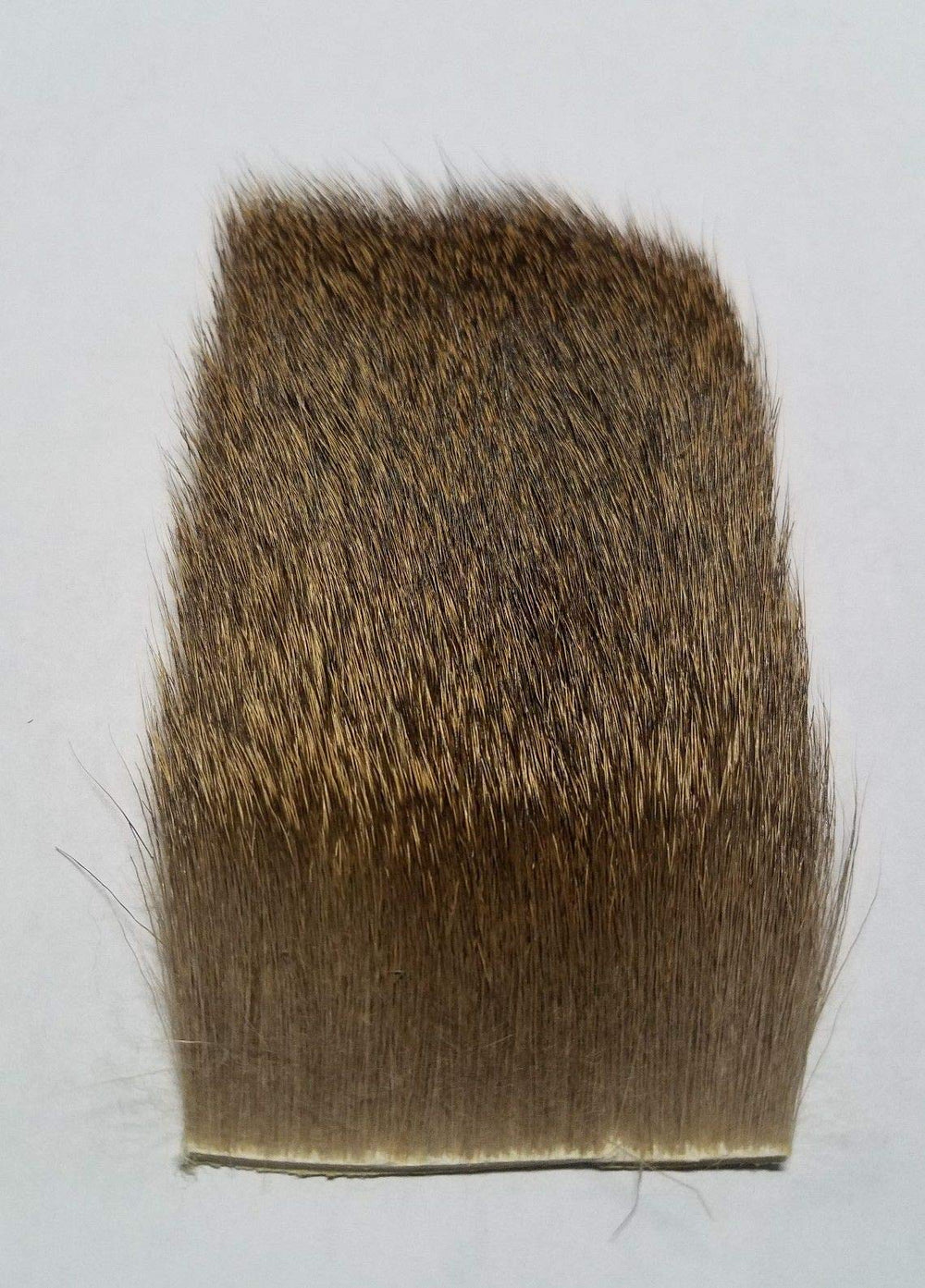 Hareline Coastal Deer Hair Dark close-up highlighting buoyant fibers for natural movement