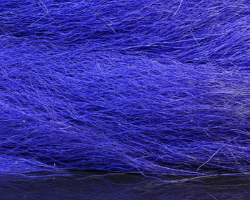 Hareline Dubbin HL Large Northern Bucktail in hand reveals tail length and texture.