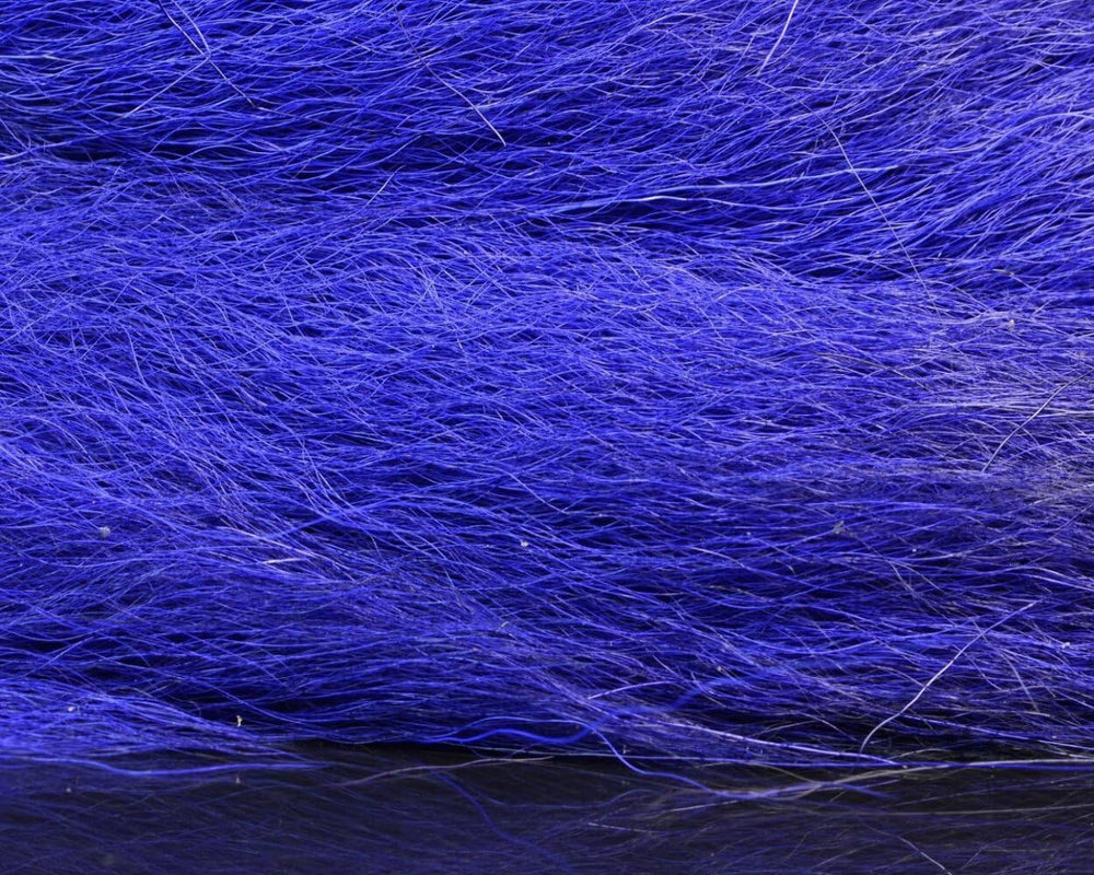 Hareline Dubbin HL Large Northern Bucktail in hand reveals tail length and texture.