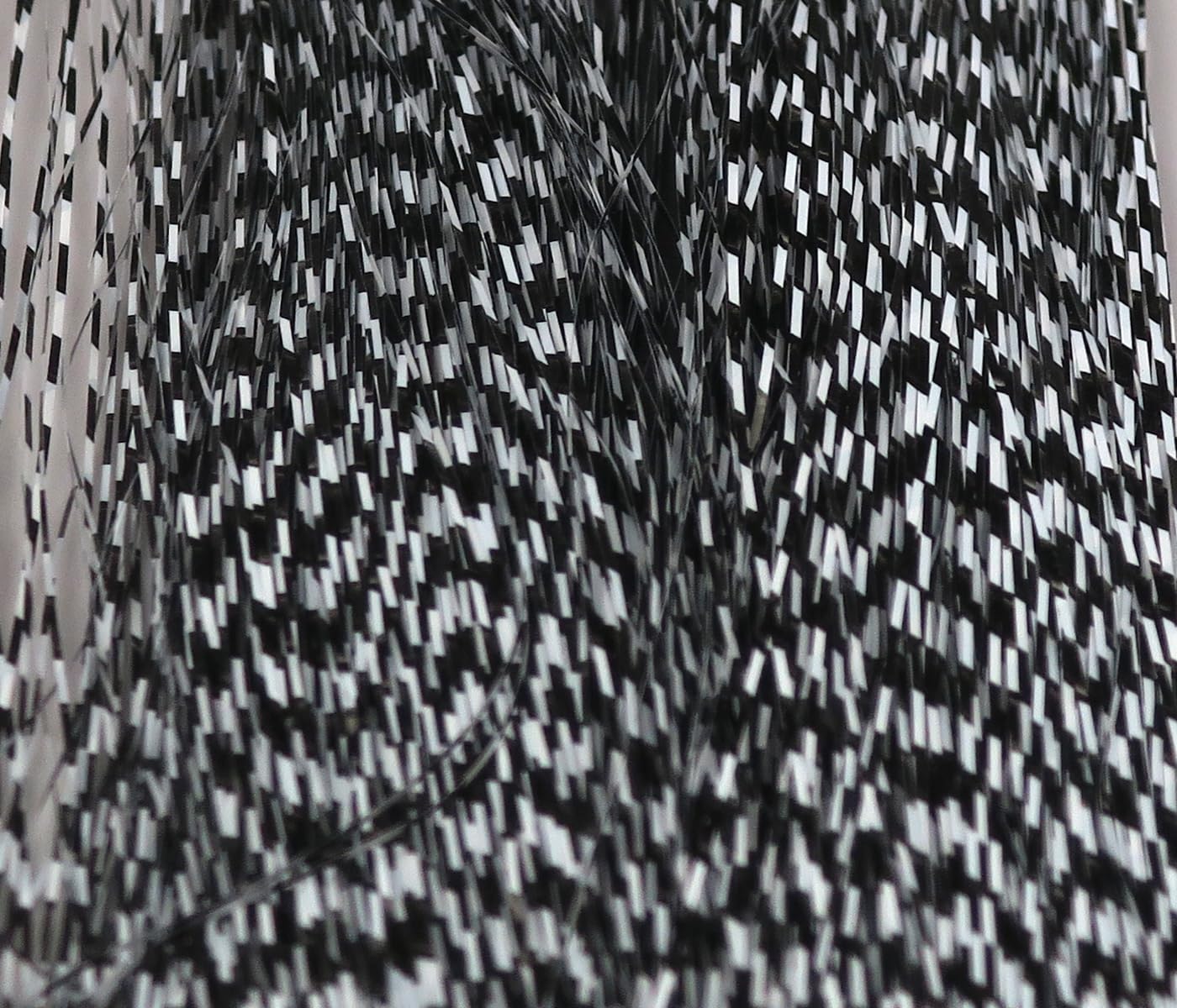 Hareline Dubbin Micro Barred Voodoo Fibers show classic black and white barred finish for small streamers.
