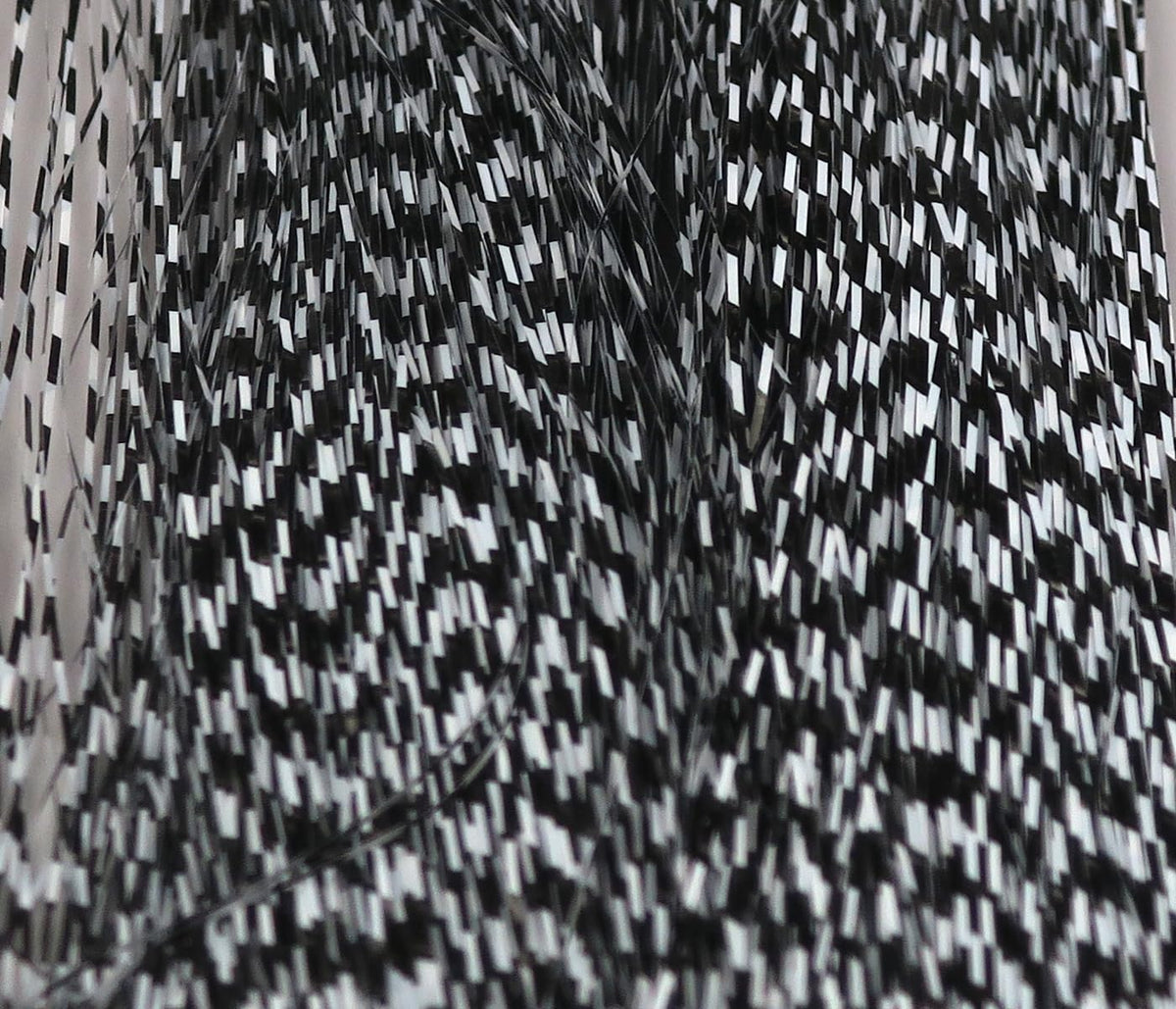 Hareline Dubbin Micro Barred Voodoo Fibers show classic black and white barred finish for small streamers.