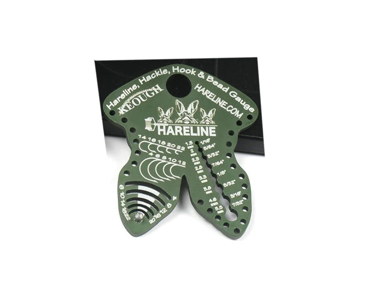Hareline Dubbin olive gauge tool close-up for precise hook, hackle, and bead sizing.