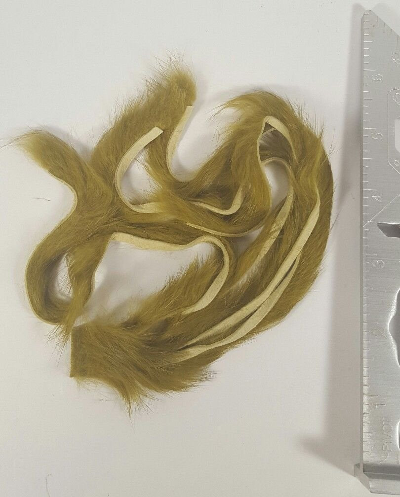 Hareline Dubbin rabbit strips in olive for lifelike movement on streamers