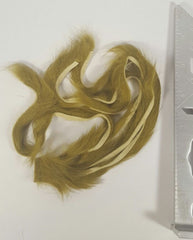 Hareline Dubbin rabbit strips in olive for lifelike movement on streamers