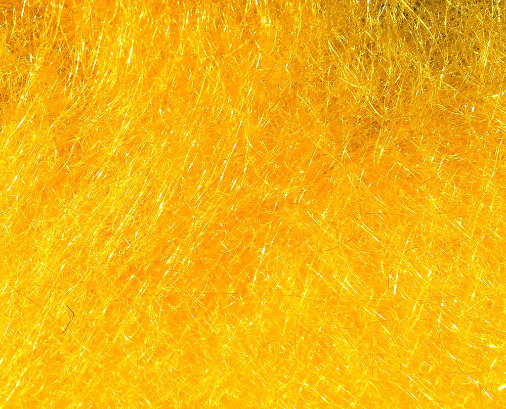 Hareline Dubbin Scud Dub 271 Orange bottle closeup highlights translucent fibers for realistic nymph patterns