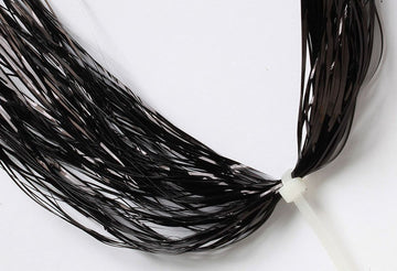 Hareline Flashabou Magnum Black strands shimmer for bold fly tying accents.