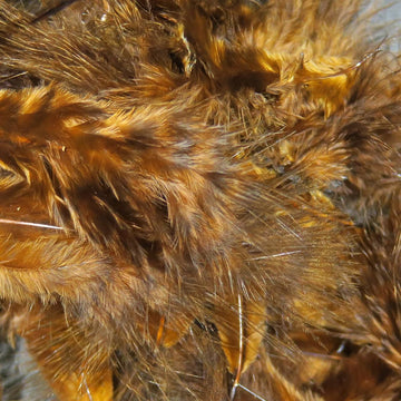 Hareline Grizzly Marabou Brown closeup highlighting barred fibers for visibility.
