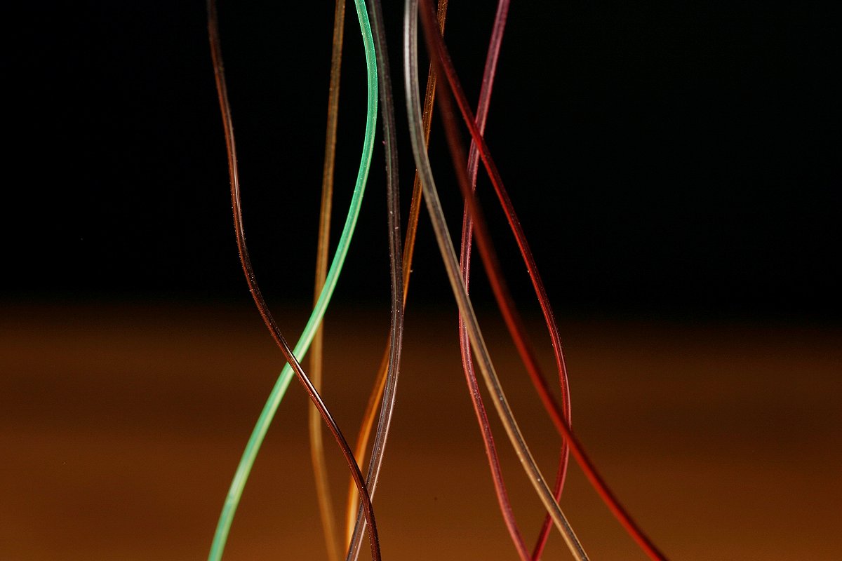 Hareline Hollow Tubing Micro Blood Red closeup highlights vivid color for fly patterns