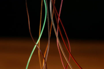 Hareline Hollow Tubing Micro Orange closeup showing vivid color for durable nymph bodies