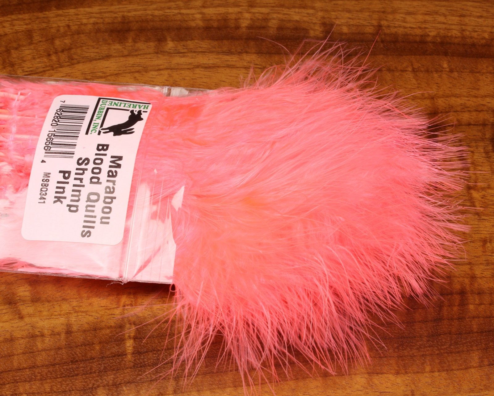 Close-up of Hareline Marabou Strung Blood Quills Shrimp Pink feathers for lifelike patterns.