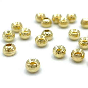 Hareline tungsten beads in gold, 3/32in, for fast sinking and precise depth