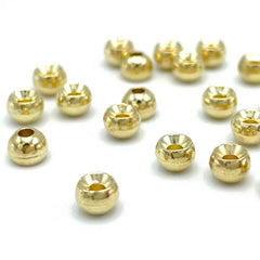 Hareline tungsten beads in gold, 3/32in, for fast sinking and precise depth