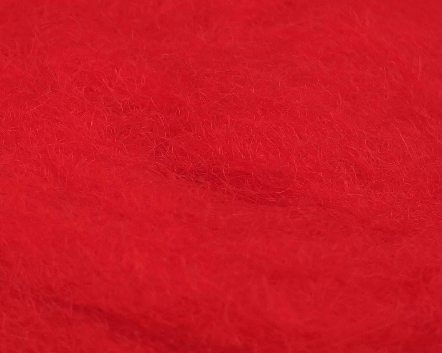 Hareline Sculpin Wool Red bundle closeup showing natural fiber ideal for sinking flies