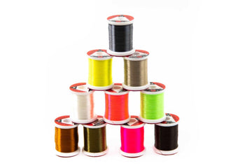 Hareline UTC Ultra Thread 70 Denier light tan on spool for precise wraps.