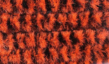 Hareline variegated chenille medium orange and black closeup showing color bands for lifelike patterns.