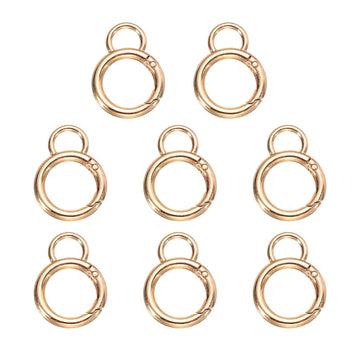 HARFINGTON spring O ring clip in gold secures keys and bags.