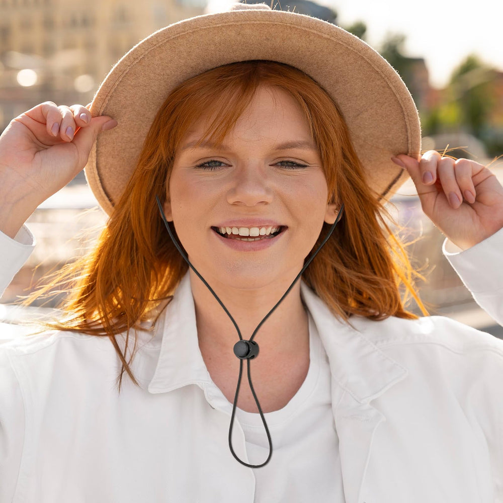 Chin cord clips securing a hat during activity