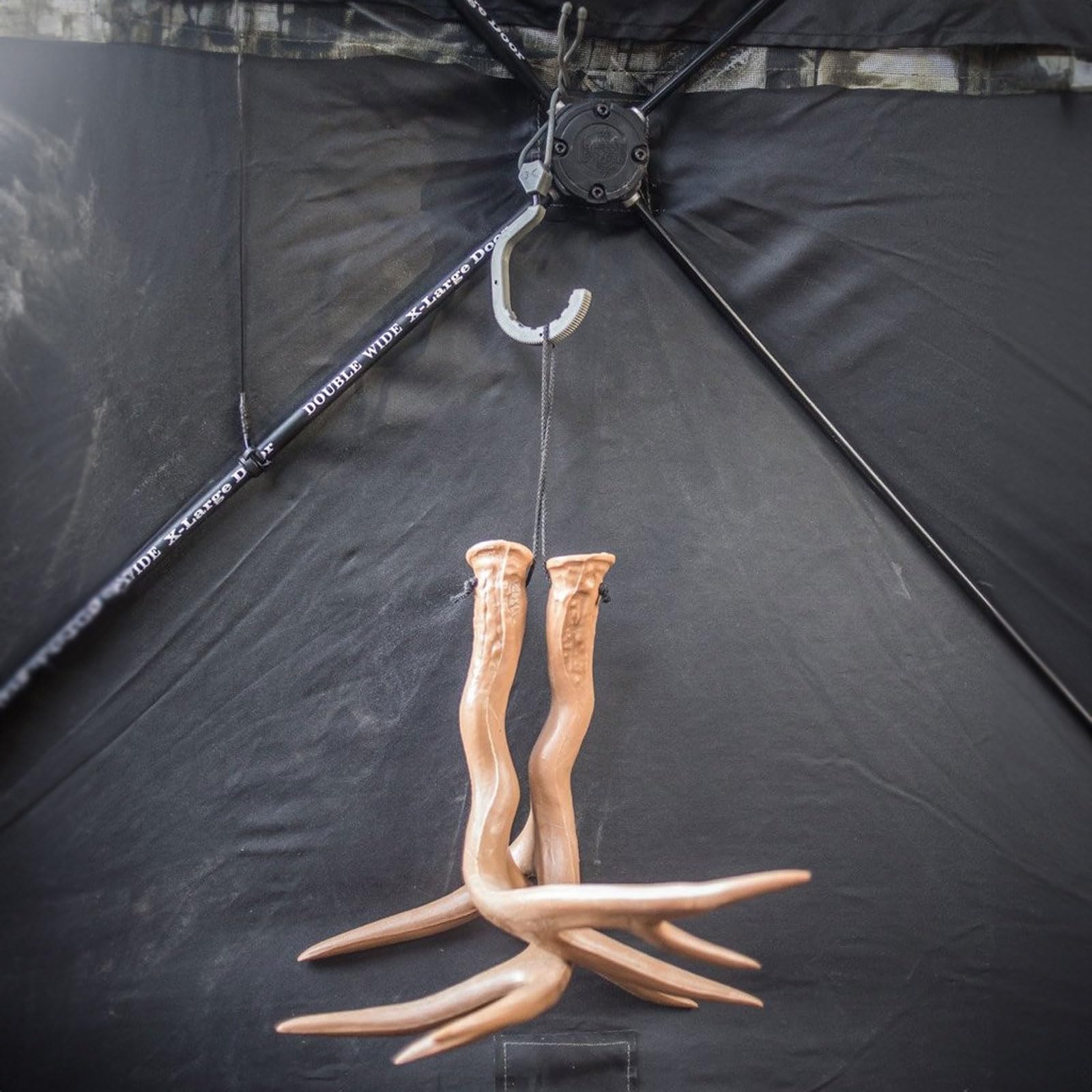 Compact Hawk Hookster 2.5 inch hanger held in hand